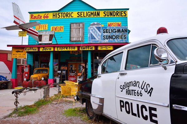 Chrysler Police Car in front of Historic Seligman Sundries Cafe.