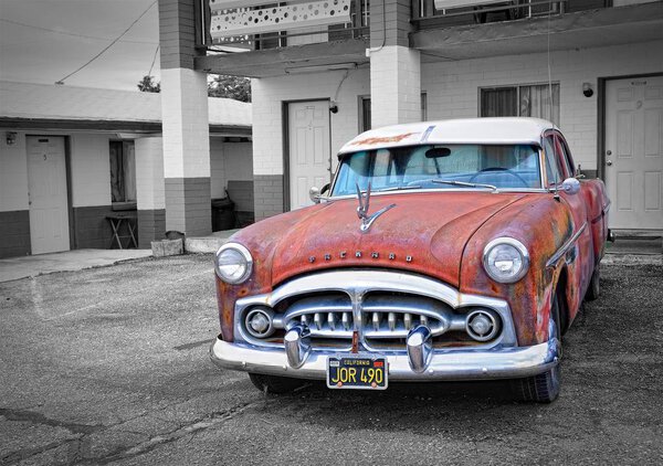 Rusty abandoned Packard car.
