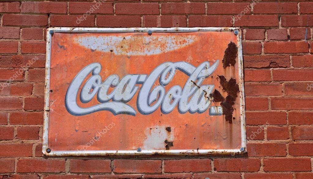 Oklahoma, Usa - July 20, 2017: Sign of Coca-Cola painted in a rusty and old metal. Coca-Cola is a carbonated soft drink produced by The Coca-Cola Company.