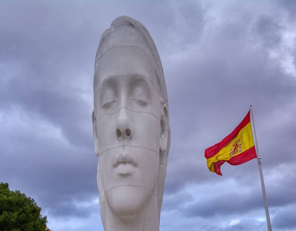 Julia sculpture by Jaume Plensa at Colon Square in Madrid, Spain.