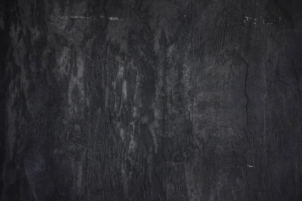 Kamenné stěně betonové strukturované černém pozadí — Stock fotografie