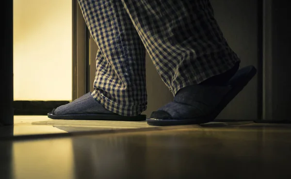 Adult man in pijamas walks to a bathroom at the night. Men's healths concept — Stock Image Adult man in pijamas walks to a bathroom at the night. Men's healths concept Royalty Free Stock Photos