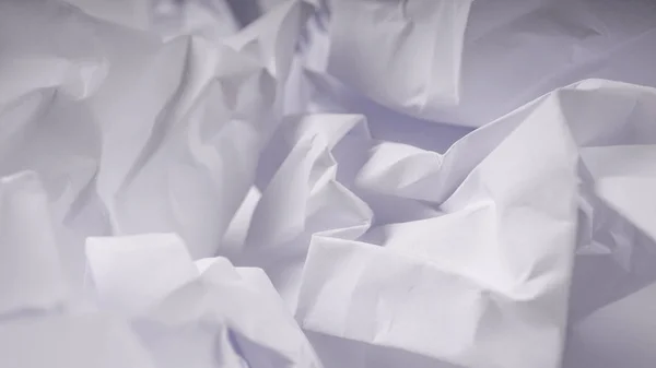 Crumpled paper on white table — Stock Photo, Image