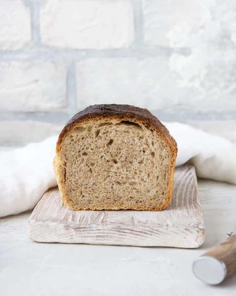 Homemade bread on a light background, healthy wholesome food, vegetarian, fresh breakfast