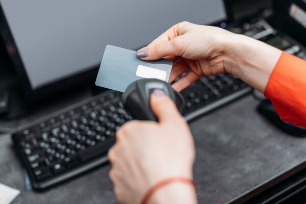 Person scanning credit card 