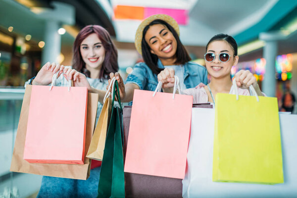 Young women with shopping bags 