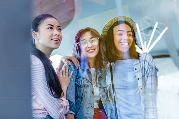 Multicultural girls in shopping mall — Stock Photo