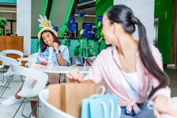 Young women in shopping mall — Stock Photo