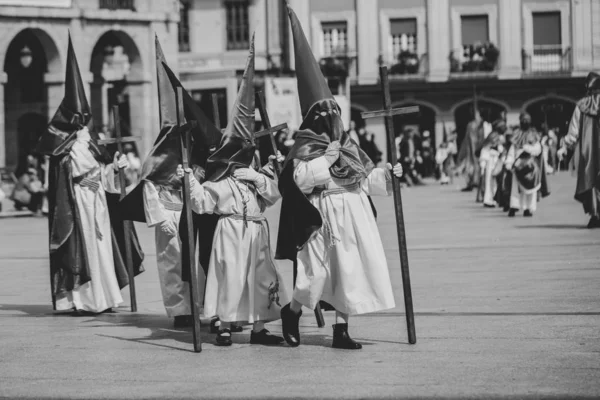 Hooded people in a procession, Holy Week