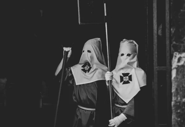 Hooded people. Procession. Holy week