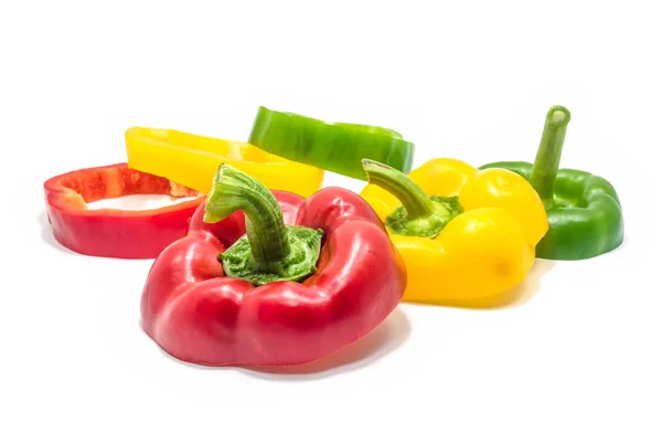 Red green and yellow slices of bell pepper isolated. — Stock Photo, Image