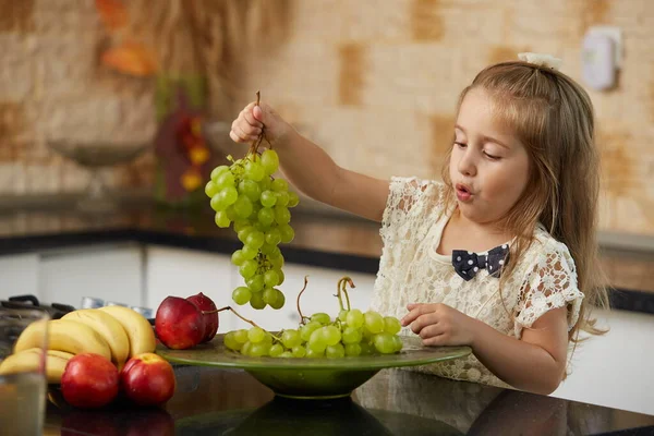 Blonde Little Girl Kitchen Holding Grape — Stock Photo, Image