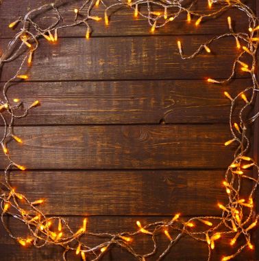 Ahşap arka plan metin için boş bir alan ile parlak ışıklar ile 