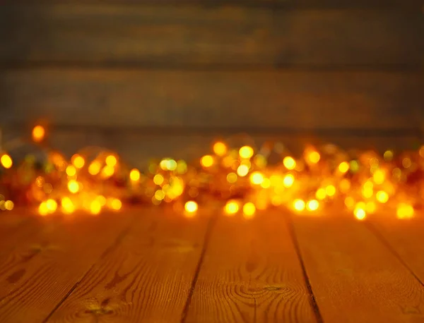 Fondo de madera con luces brillantes con un espacio libre para texto — Foto de Stock