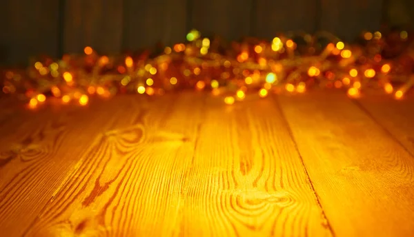 Fondo de madera con luces brillantes con un espacio libre para texto — Foto de Stock