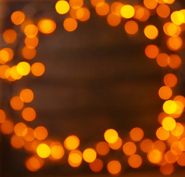 Fundo de madeira com luzes brilhantes com um espaço livre para texto Fotografia De Stock