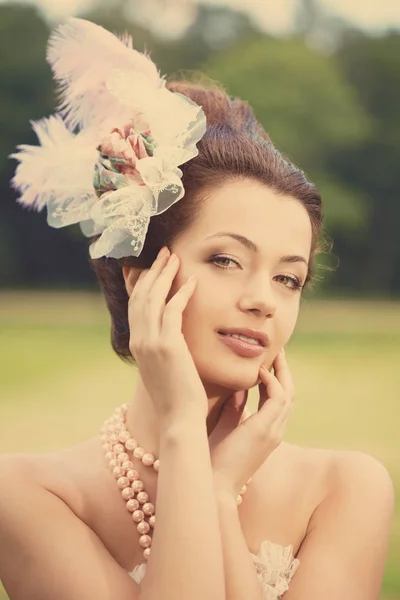 Portrait of vintage woman. The girl in the dress of the last century. Beautiful woman in long evening dress. Fairy Princess. Toned