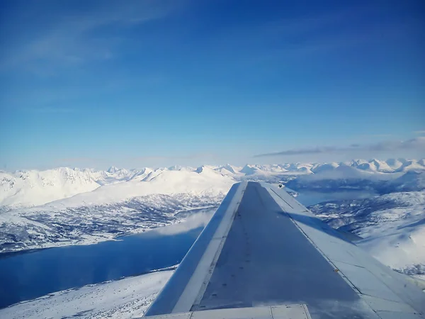 Clouds under the wing of an airplane — Stock Photo, Image