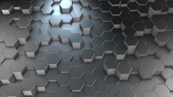 Une surface abstraite en aluminium géométrique hexagonale se déplace cycliquement dans l'espace virtuel. Vibrations chaotiques de formes géométriques. Création d'un mur dynamique d'hexagones 