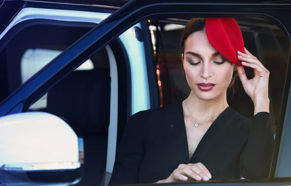 Attractive young woman near the sports car. Beauty, fashion. — Stock Photo, Image