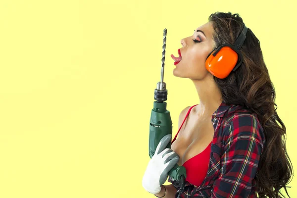 Sexy girl holding a power drill — Stock Photo, Image