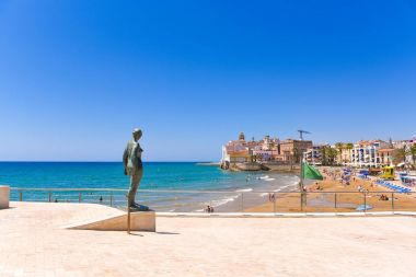 SITGES, CATALUNYA, SPAIN - JUNE 20, 2017: Sculpture of a naked woman on the waterfront. Copy space for text. clipart