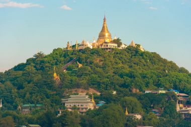 MANDALAY, MYANMAR - DECEMBER 1, 2016: Golden Pagoda in Sagaing hill, Burma. Copy space for text. clipart
