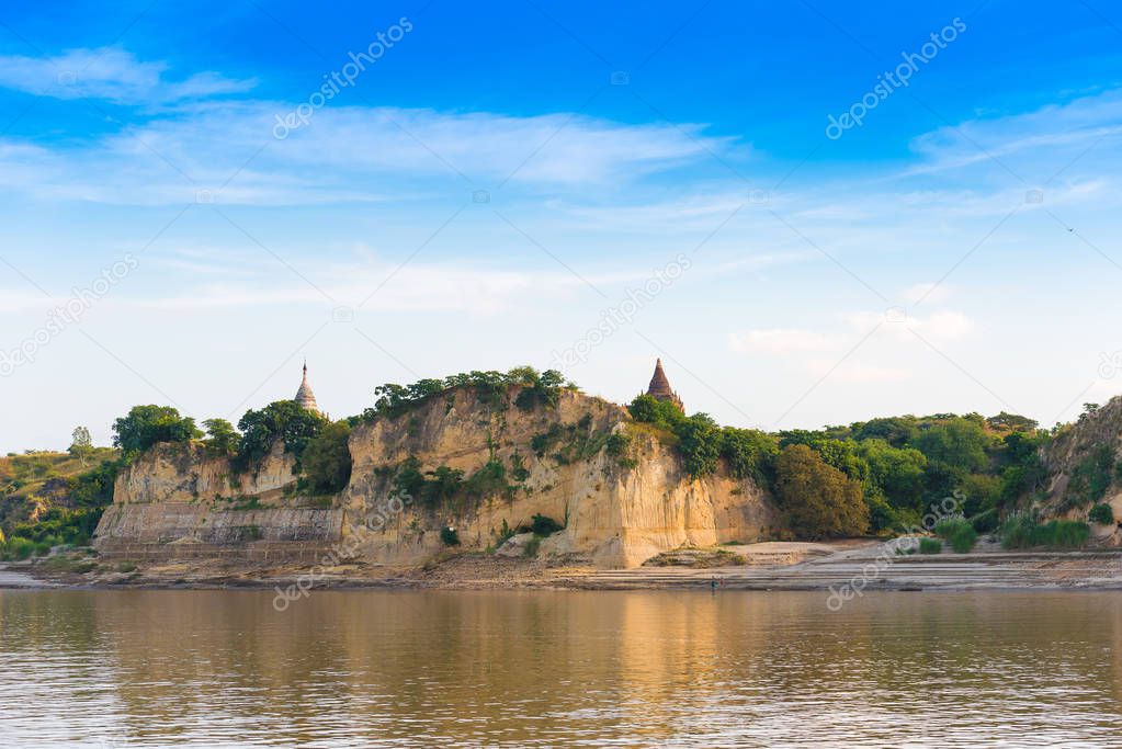 Pagoda on the bank of the Irrawaddy river, Mandalay, Myanmar, Burma. Tour from Mandalay to Bagan. Copy space for text.