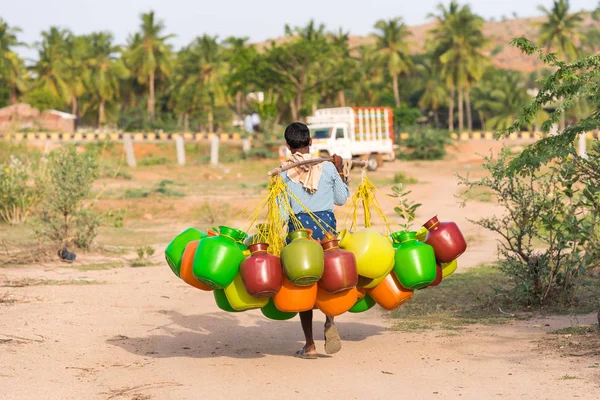Indian man goes for water, Puttaparthi, Andhra Pradesh, India. Copy space for text. — Stock Photo, Image