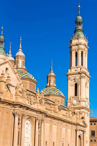 The Cathedral-Basilica of Our Lady of Pillar - a roman catholic church, Zaragoza, Spain. Copy space for text. Vertical. — Stock Photo, Image