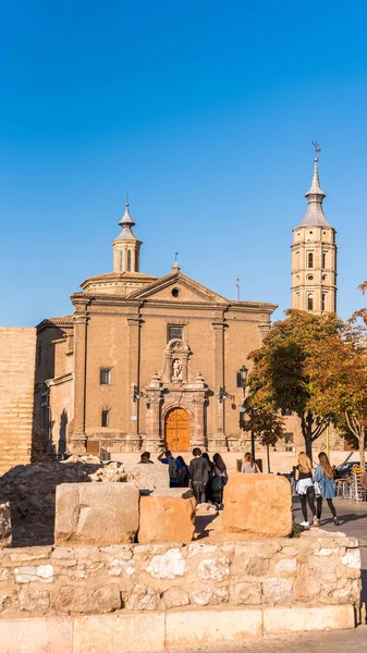 Roman walls in the background of the church Iglesia de San Juan de los Panetes, Zaragoza, Spain. Copy space for text. Vertical. — Stock Photo, Image