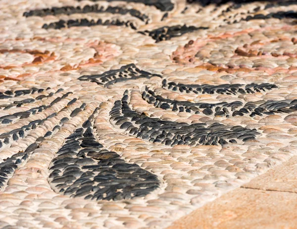 Imagem abstrata de um pavimento antigo em Tarragona, Catalunha, Espanha. Close-up . — Fotografia de Stock