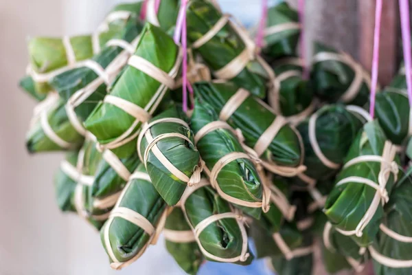 Food wrapped in banana leaves in Luang Prabang, Laos. Close-up.