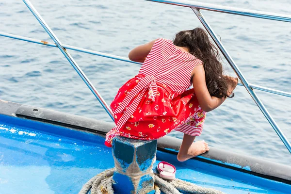 Girl in a deck boat dress, Male, Maldives. Copy space for text. Back view. — Stock Photo, Image