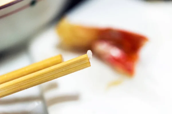 Rice on Japanese sticks, Tokyo, Japan. Close-up. With selective focus. — Stock Photo, Image