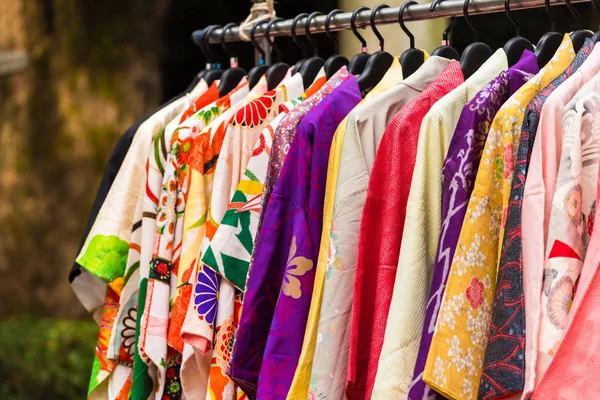 Sale of colorful kimonos on the city street in Kyoto, Japan. Close-up. — Stock Photo, Image