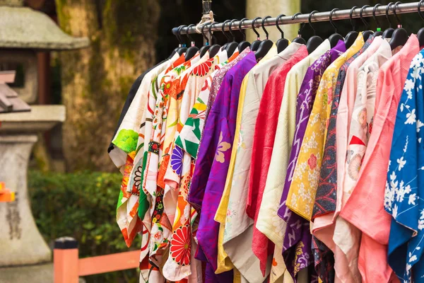 Sale of colorful kimonos on the city street in Kyoto, Japan. Close-up. — Stock Photo, Image