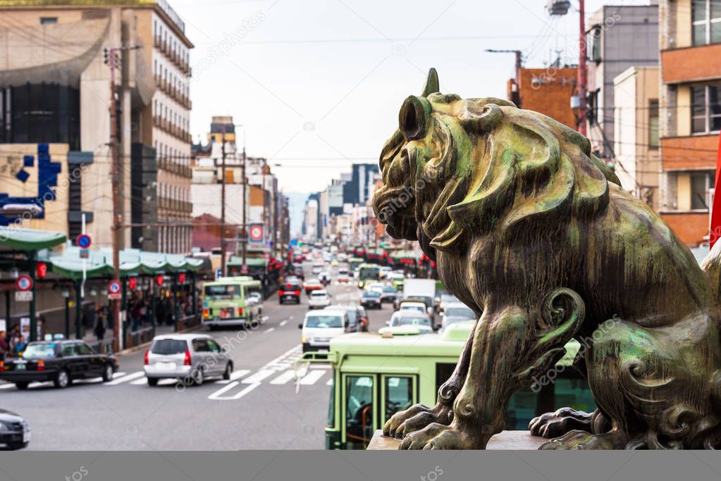 Sculpture of a lion on a background of the urban landscape in Kyoto, Japan. Copy space for text.  