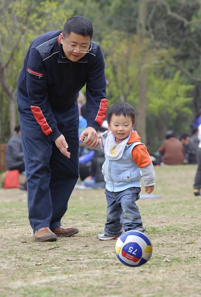 Baby playing football with his father — Stock Photo, Image