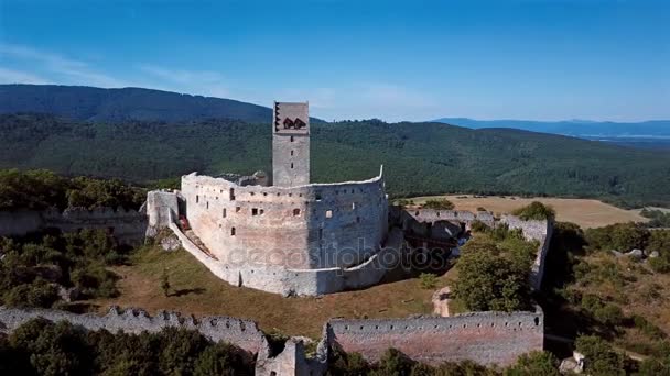 Flying around abandoned ruined castle in hills. — Stock Video