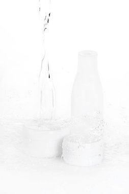 water drops falling on bottle and boxes clipart