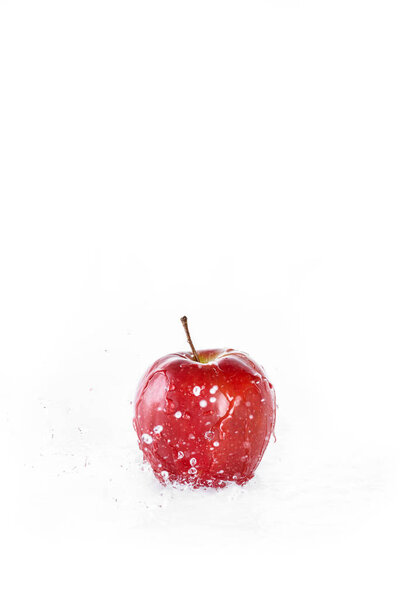 red fresh apple with water drops