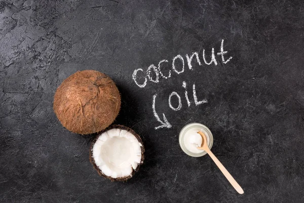 Coconut oil and nut — Stock Photo, Image