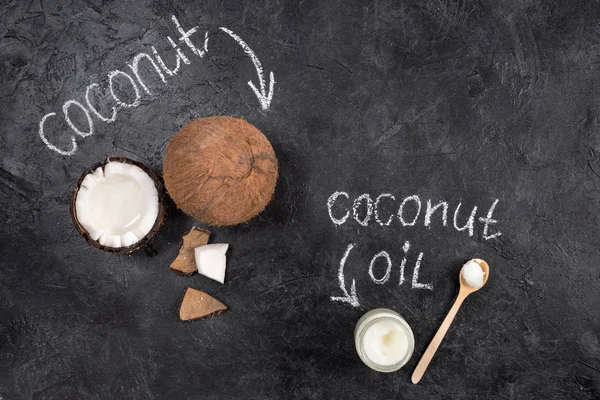 Coconut oil and nut — Stock Photo, Image