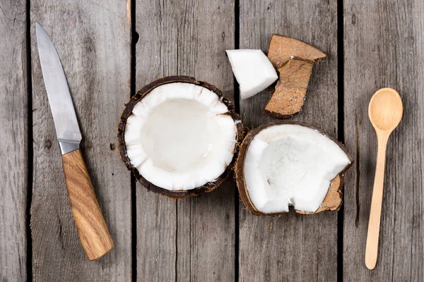 Tropical coconut with knife and spoon — Stock Photo, Image