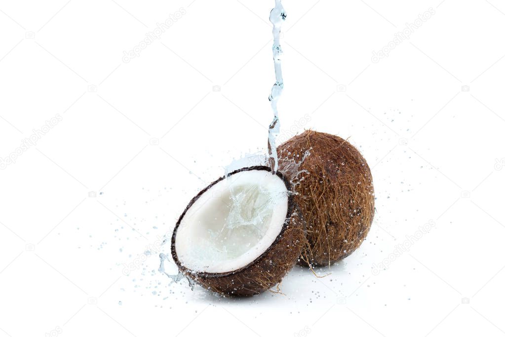 ripe tropical coconuts with water
