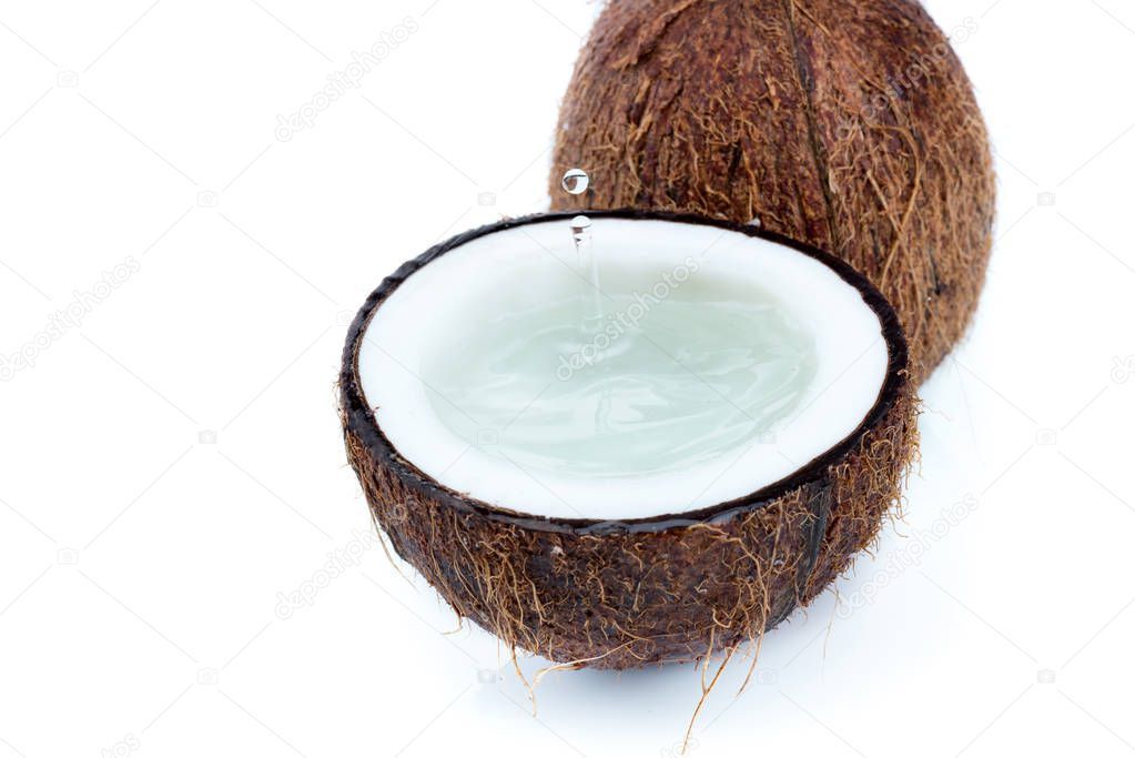 ripe tropical coconuts with water