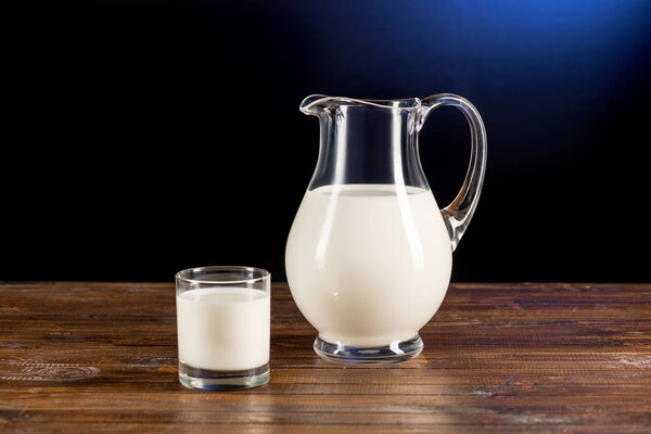Fresh milk in glass and jug 