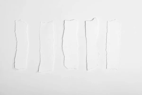 Torn empty white papers — Stock Photo, Image