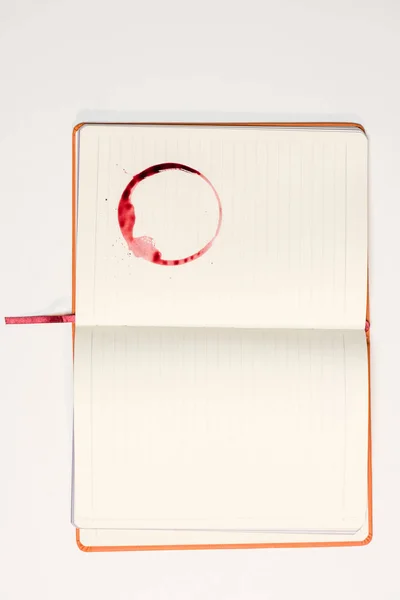 Blank notebook with red wine stain — Stock Photo, Image